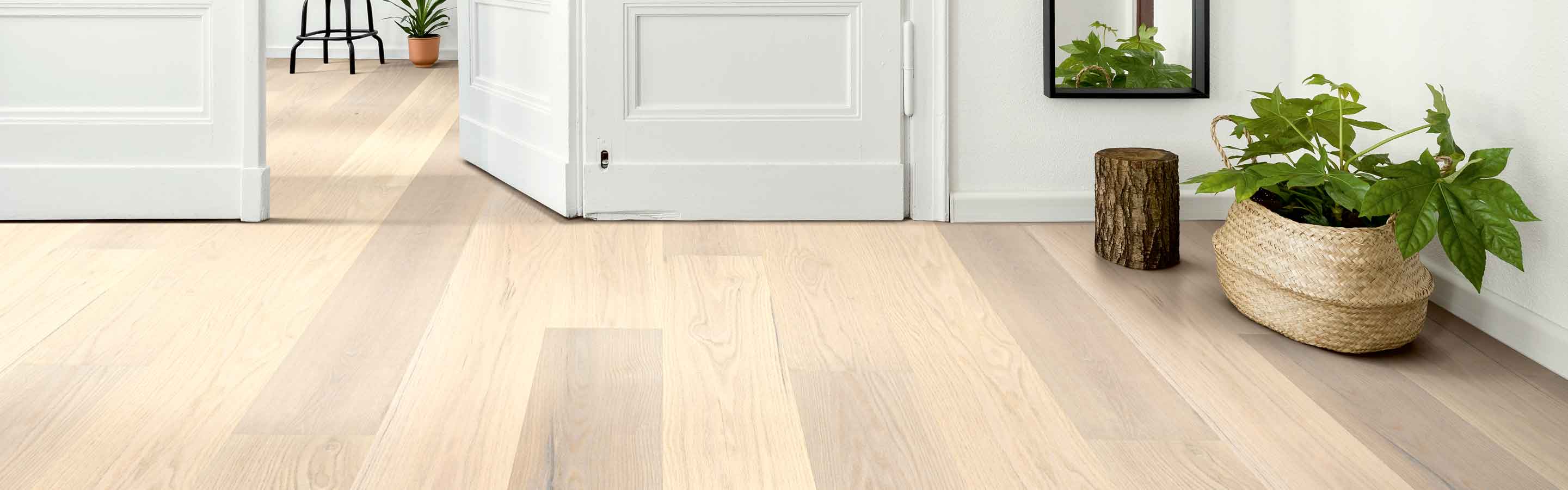 modern entryway with light oak hardwood floors and wood accents